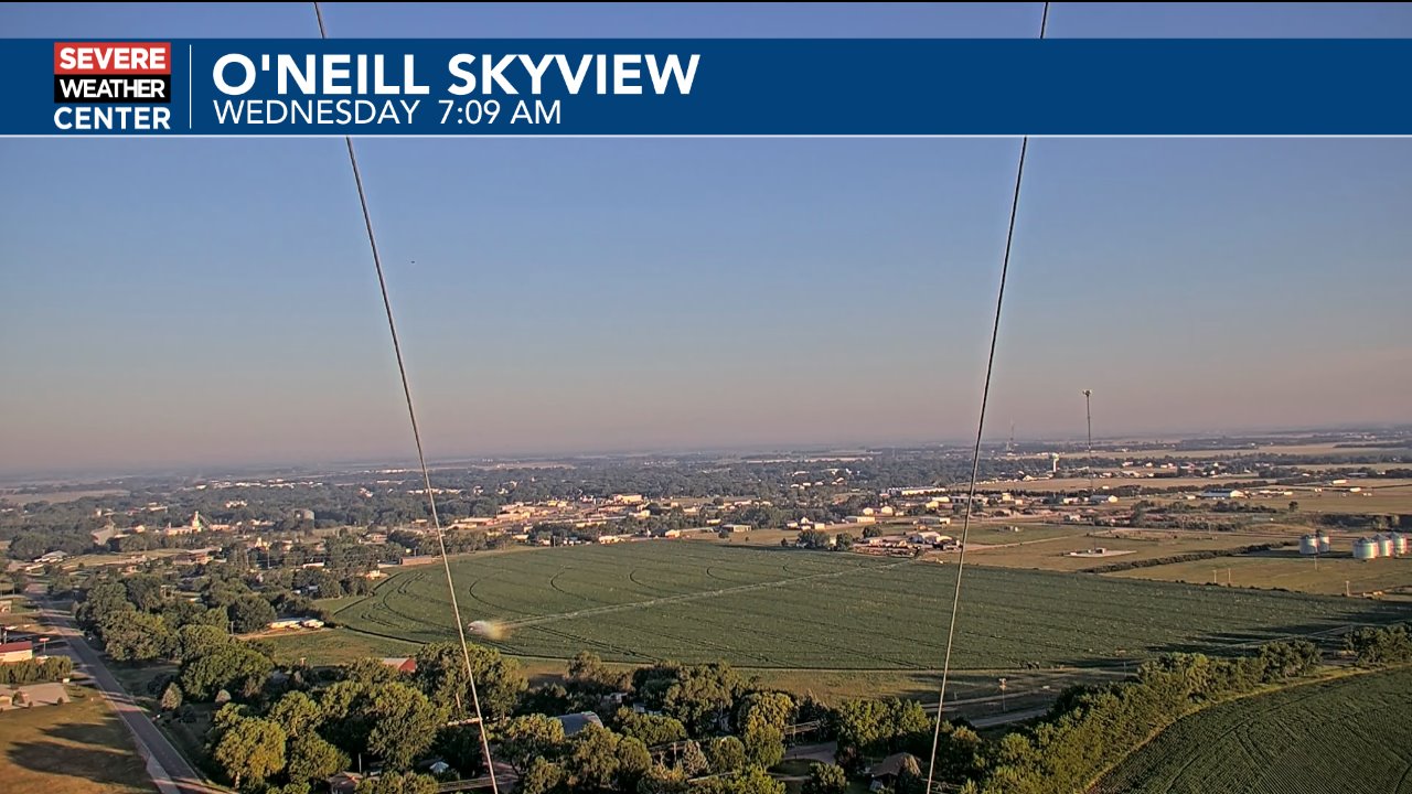 Morning aerial view of fields and a small town captured by a weather skyview camera with an ONEILL SKYVIEW banner across the top