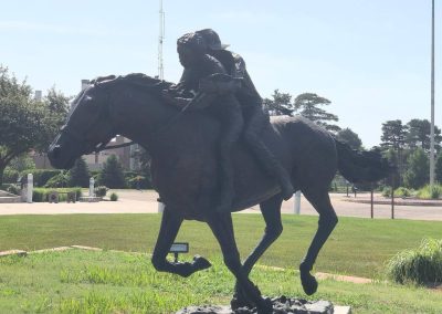 Martin Brothers Bronze Statue Nebraska Directory Bronze statue of two boys riding a horse at a gallop depicting the Martin Brothers 1864 escape