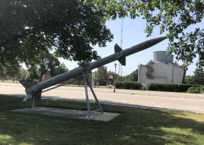 Missile Display Nebraska Directory Vintage military missile mounted on a display stand in a Hastings park