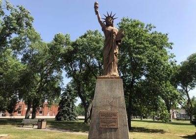 Statue of Liberty Replica Nebraska Directory Statue of Liberty replica on a stone pedestal in a Hastings park donated by the Boy Scouts of America