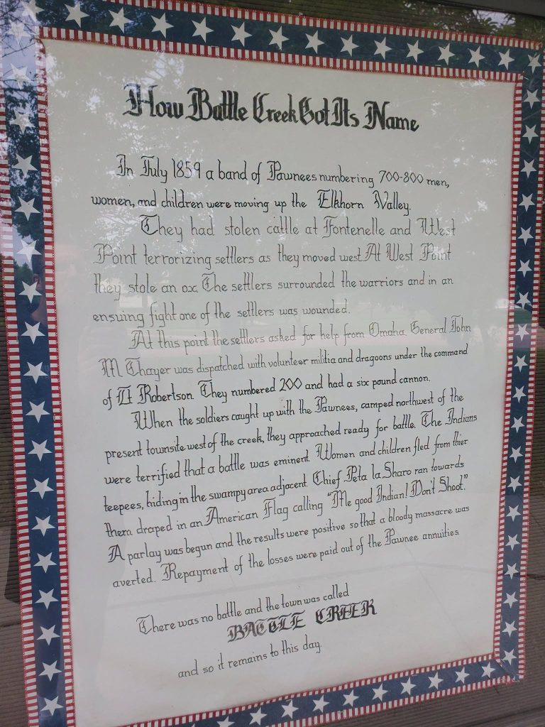 Hand-lettered sign telling how Battle Creek got its name in 1859