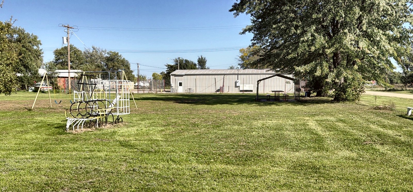 Inman-City-Park-featured Inman City Park with its train climber, picnic shelter and community building