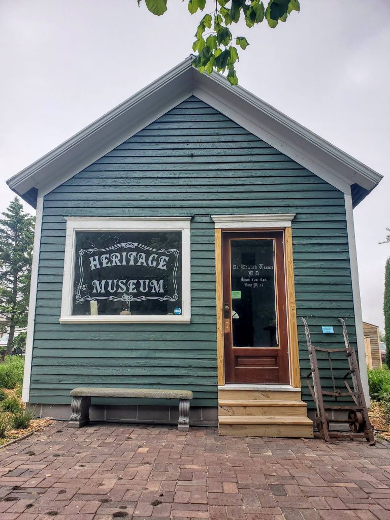 The Heritage Museum building in Battle Creek Heritage Park, its door lettered for Dr. Edward Tanner, M.D.