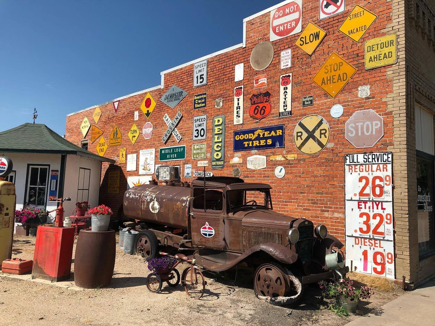 Vintage sign wall and old truck, Comstock, Nebraska