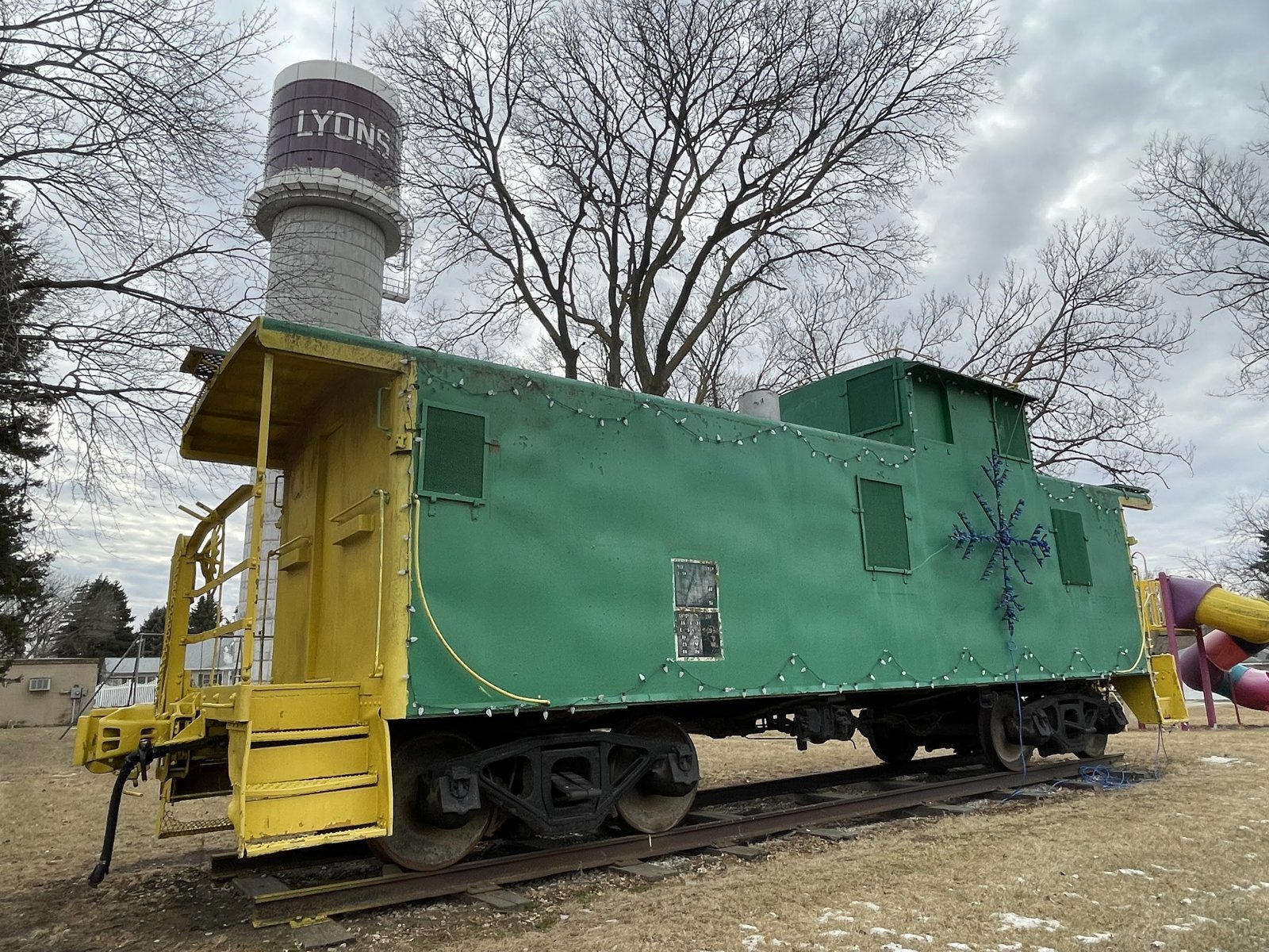 Caboose and water tower, Lyons, Nebraska